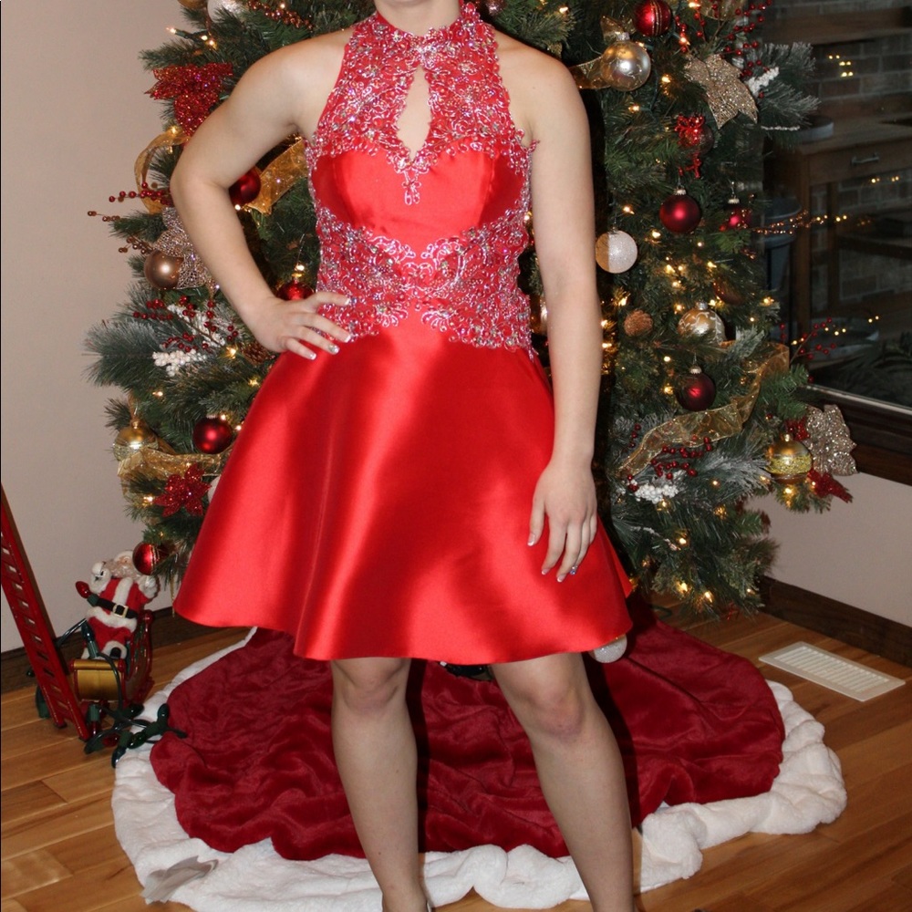 This is a bright red and silver detailed homecoming dress.